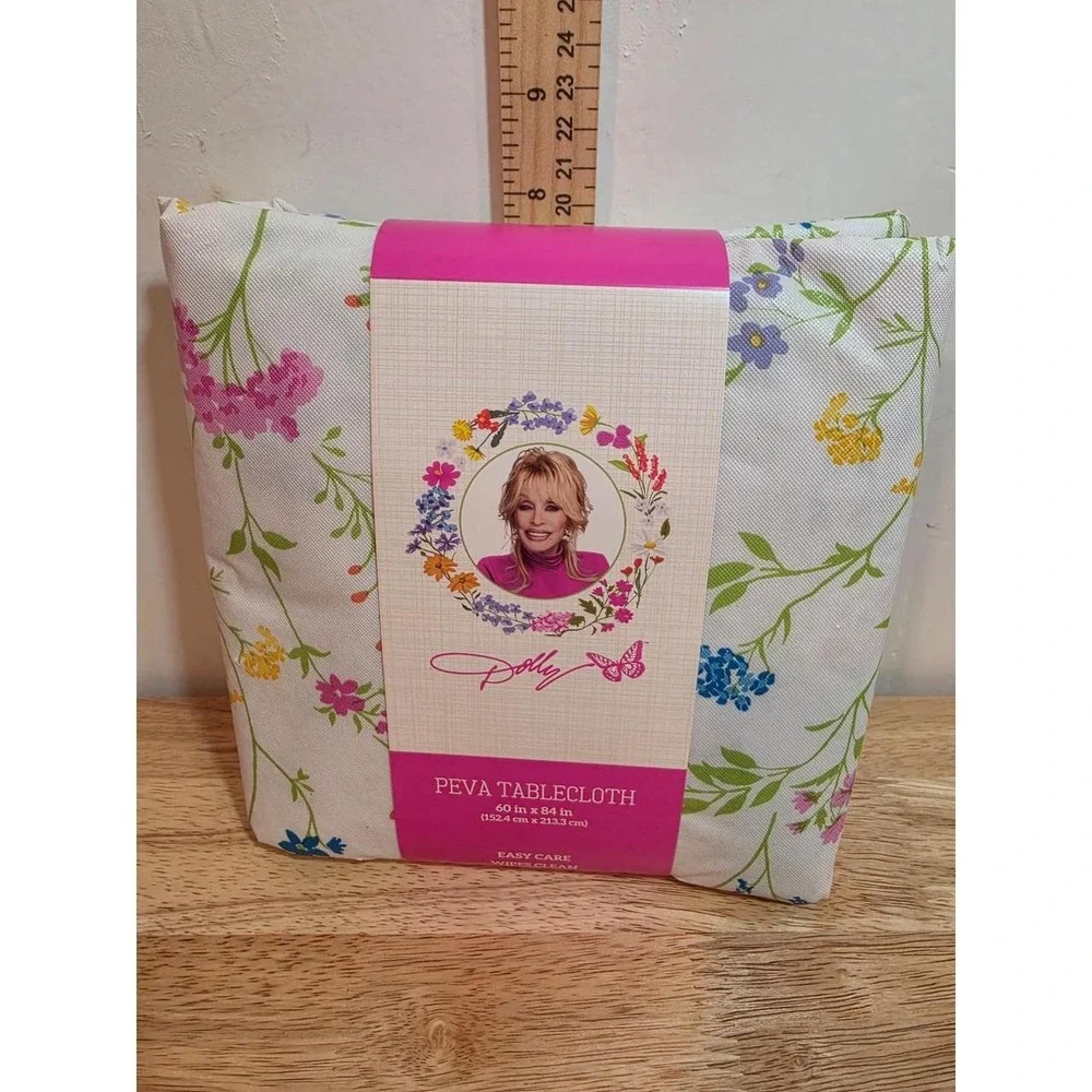 Dolly Parton Spring PEVA tablecloth featuring a white background flowers